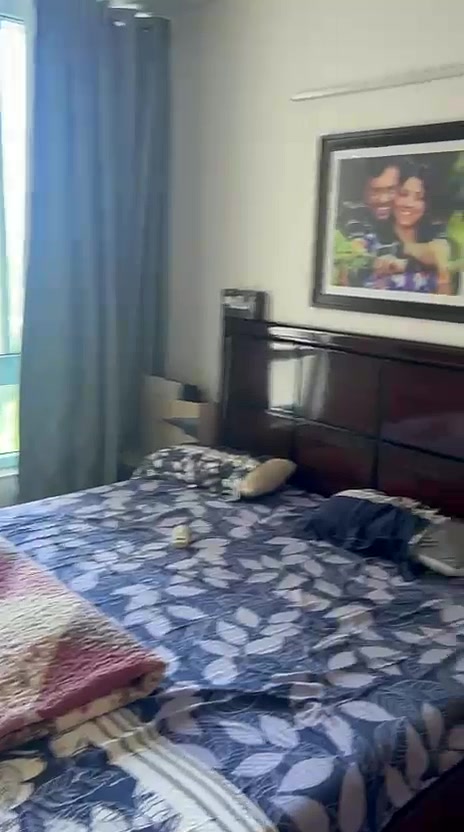 Bedroom with balcony access in the 3 BHK apartment for sale at Puri Emerald Bay Sector 104 Gurgaon